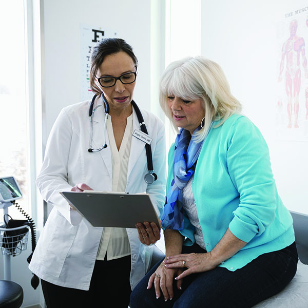 Doctor and patient looking at chart