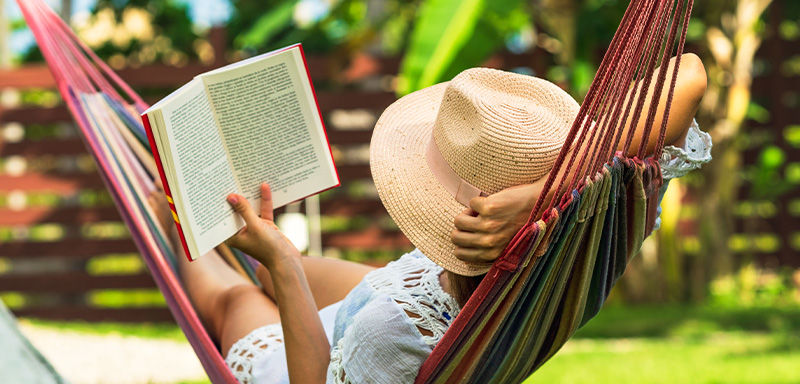 Woman in hammock reading